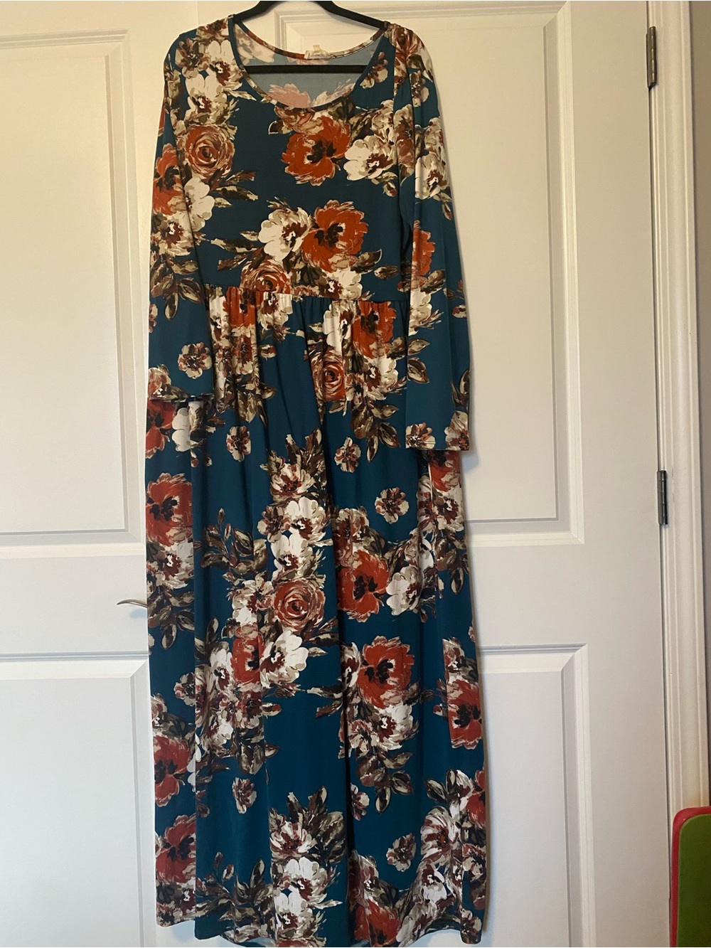 Sweet lovely boutique brand that Floral Teal Long Sleeve Maxi Dress